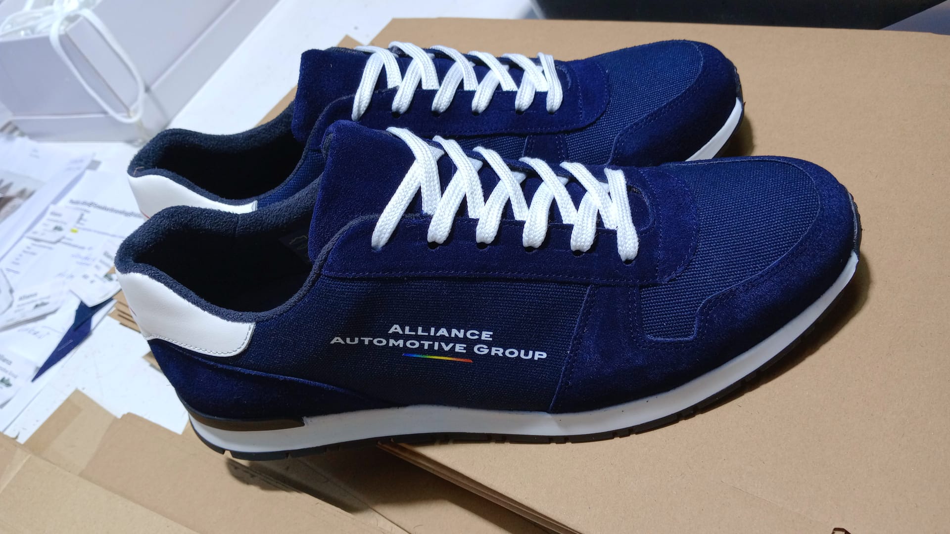 Alliance Automotive Group navy suede sneaker with printed wordmark and gradient accent
