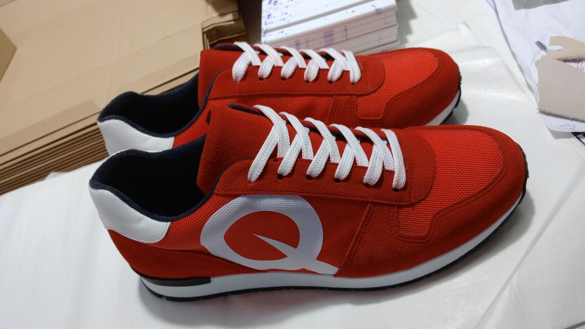Quantum custom logo sneaker in red with white Q wordmark